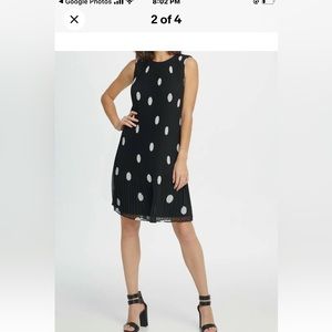 DKNY Dress Stretch Polka Dot Net With a black Lining . Flare Shape.New With Tags